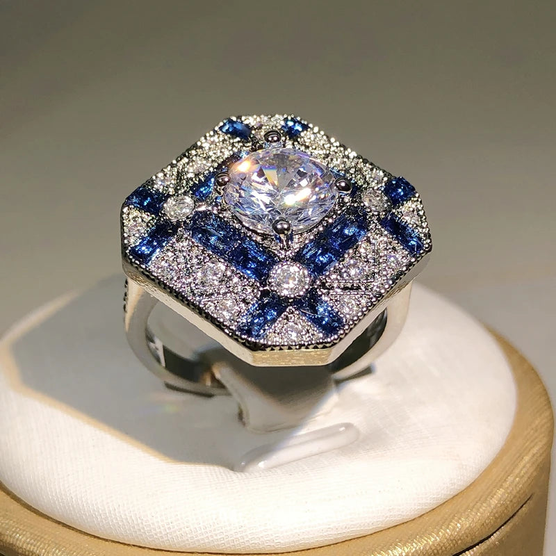 Luxury diamond and sapphire ring on a display stand