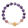 Purple beaded bracelet with gold accents on a white background