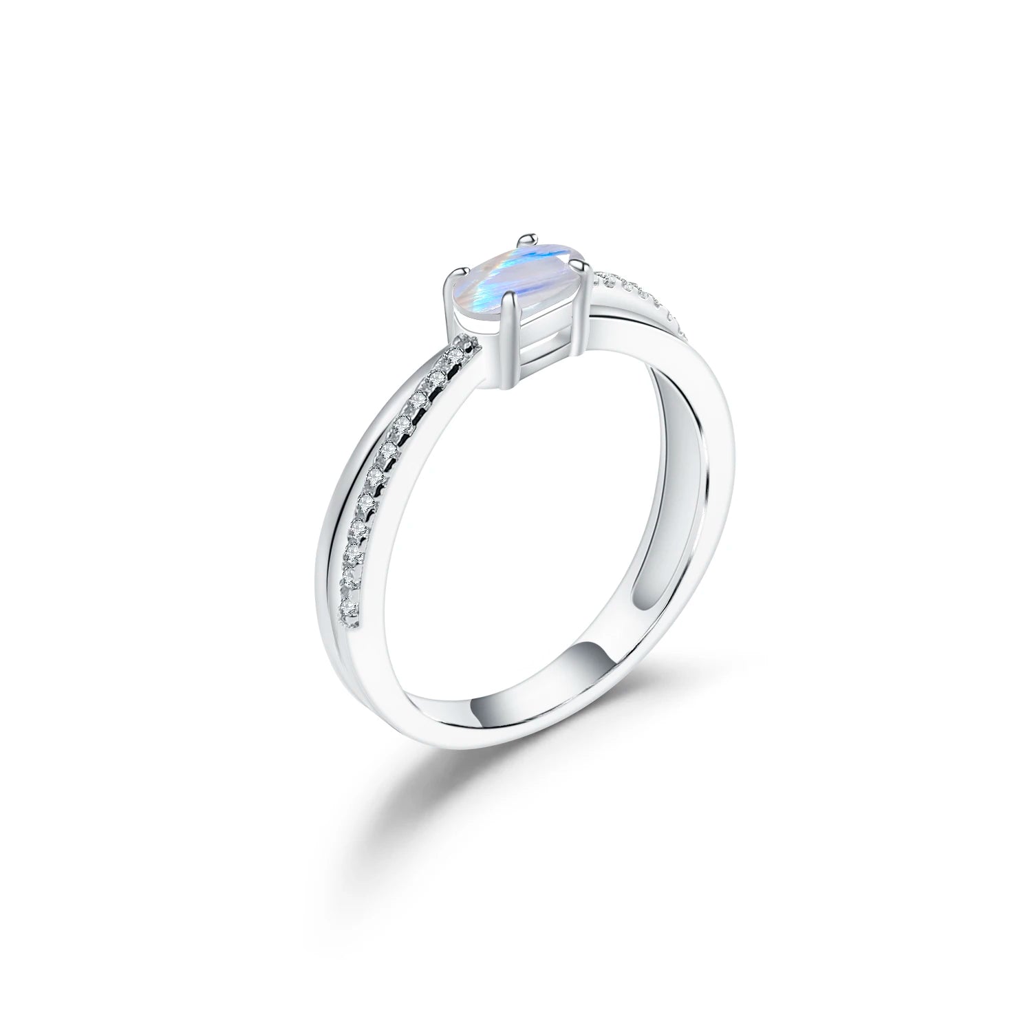 Silver ring with a central gemstone on a white background